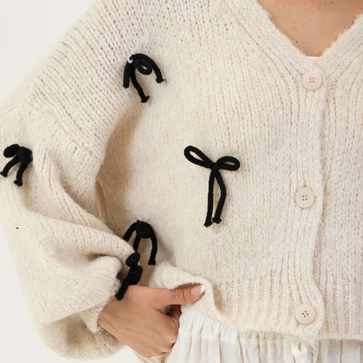Cleo | Cárdigan oversize con mini lazos
